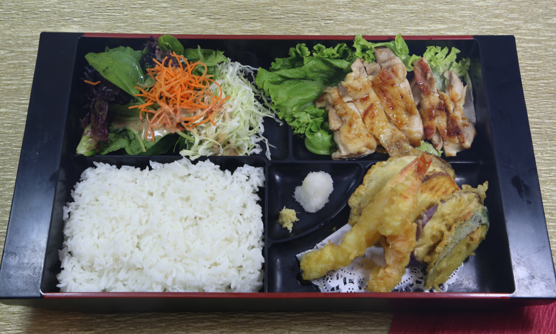 Dinner combination bento with chicken teriyaki, karaage, and shrimp tempura